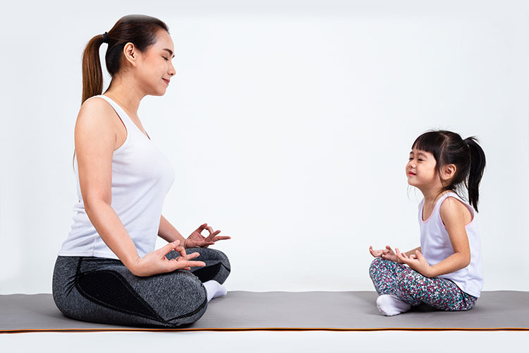 young-mother-training-lovely-daughter-with-yoga